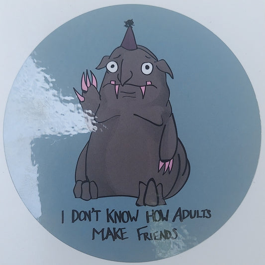 A gray monster with pink claws and a party hat waving sheepishly. The text reads "I Don't Know How Adults Make Friends"